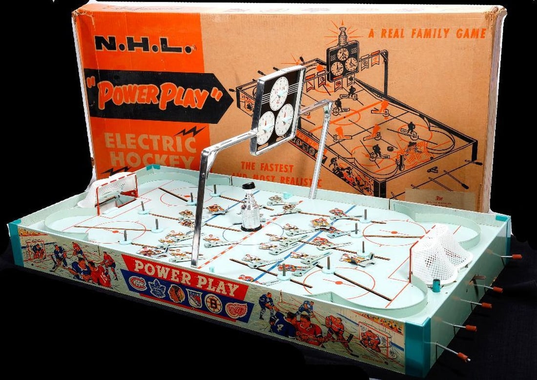 1959 N.H.L. "Power Play" Electric Hockey Game: Tabletop N.H.L. "Power Play" Electric Hockey game in original box (18 1/2" x 39" x 4 1/2"). Includes instructions; appears to have most parts/players.