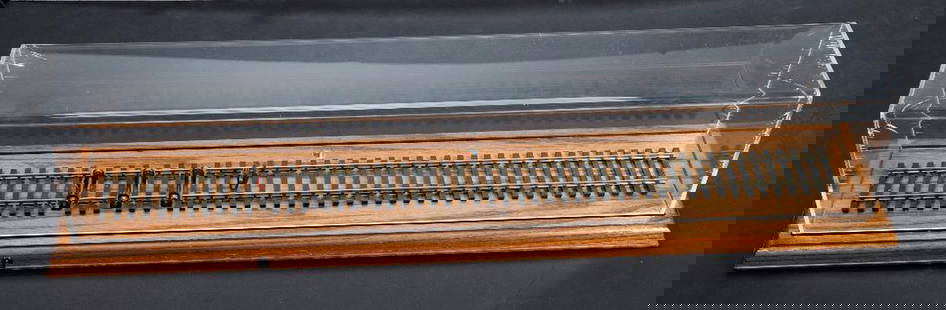 Lionel O Gauge Display Case with Rollers: Lionel Display Case with Rollers and Lionel Logo Three Rollers Power feed wires have been cut. Base is 28.5 x 6 inches. Track is 24 inches. Plexiglass top has stress cracks at corners.