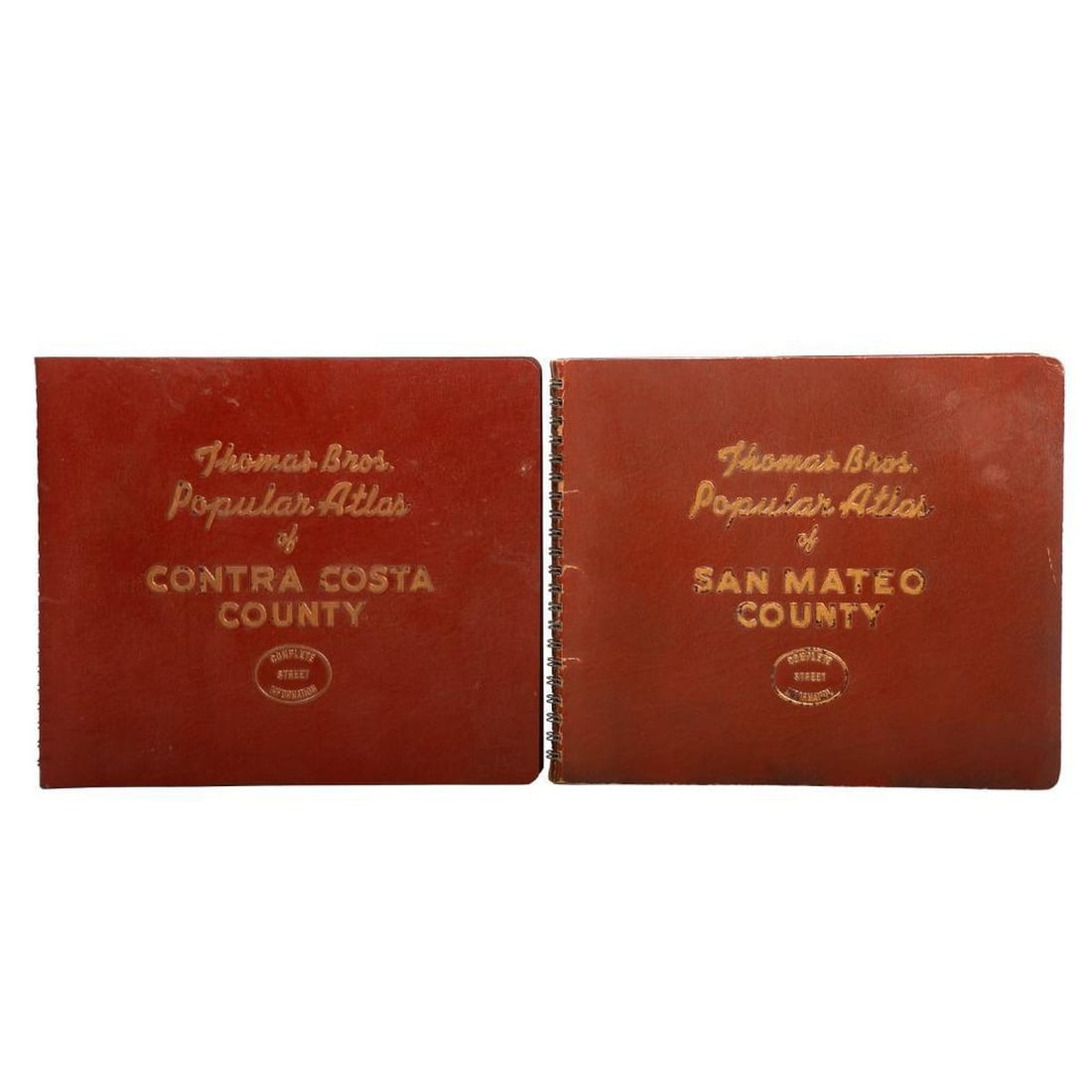 1950s Thomas Bros. Atlases, San Mateo/Contra Costa Co., with another: THOMAS BROS. POPULAR ATLAS. 1.) San Mateo County, 1953 Edition. 2.) Contra Costa County, 1956 Edition. Spiral-bound embossed covers, 7 3/4" x 9." Condition: overall good; some scuffing/wear to covers;
