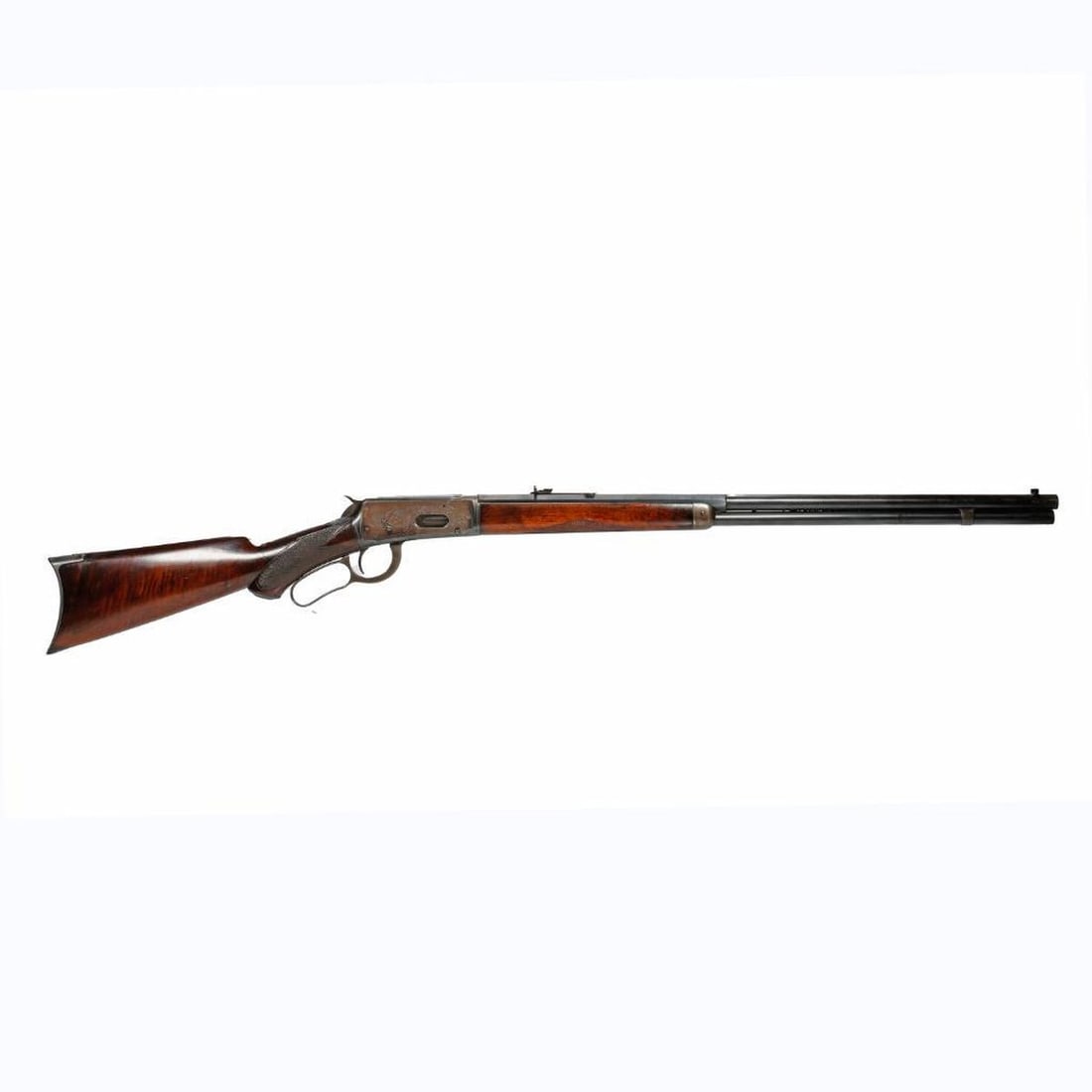 Antique Winchester Model 1894 Rifle: Magazine lever action, Caliber: .38-55. Serial 43986, blue finish half octagonal and half round two line barrel, walnut stocks, Buckhorn rear sight. Top of barrel marked "MANUFACTURED BY THE/WINCHESTE