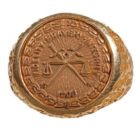 An FBI gold 20 year service medal ring