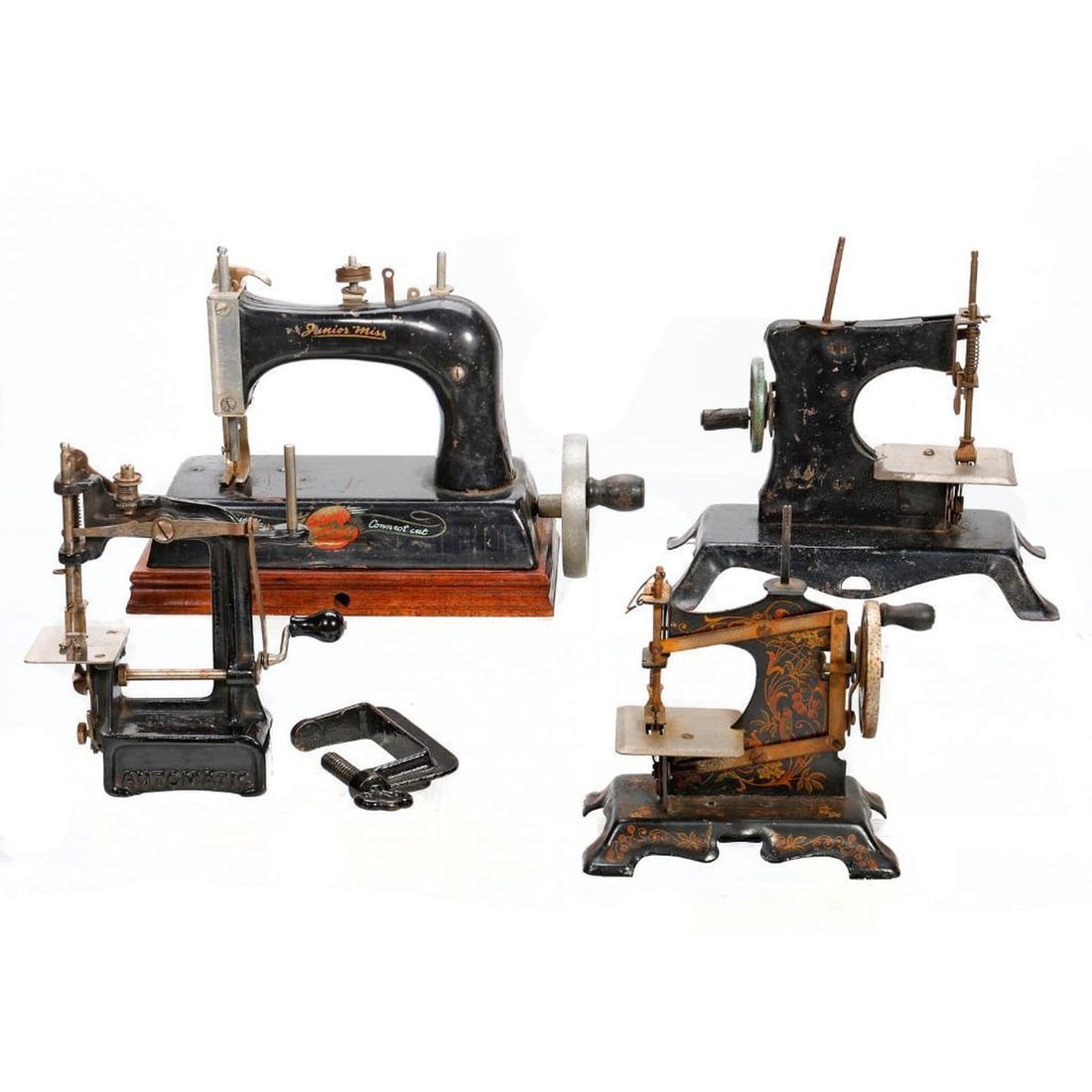 Four Vintage Miniature Sewing Machines: Comprising a boxed "Smith & Egge" Automatic Sewing Machine with a clamp; a Junior Miss by Artcraft; a German in the Art Nouveau style, and one other Condition: some losses to bobbins, minor rusting to