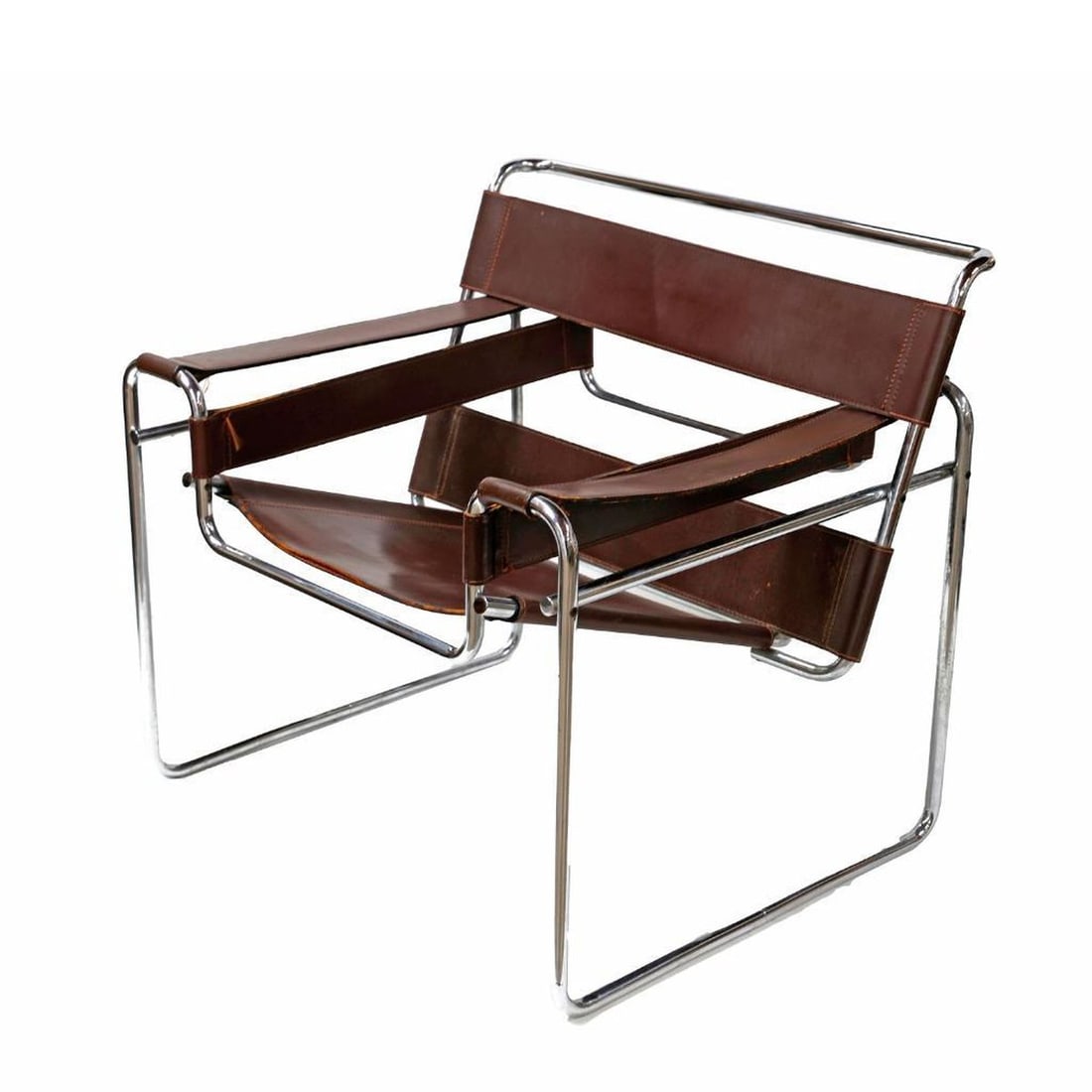 Marcel Breuer Wassily Lounge Chair: Probably Knoll, circa 1970, unmarked. Dimensions 29"h x 29"w x 25.5"d. Overall good condition, chair and seat sturdy, with minor losses to leather stitching, light rust marks on legs. Provenance: The