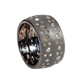 A diamond and blackened silver ring