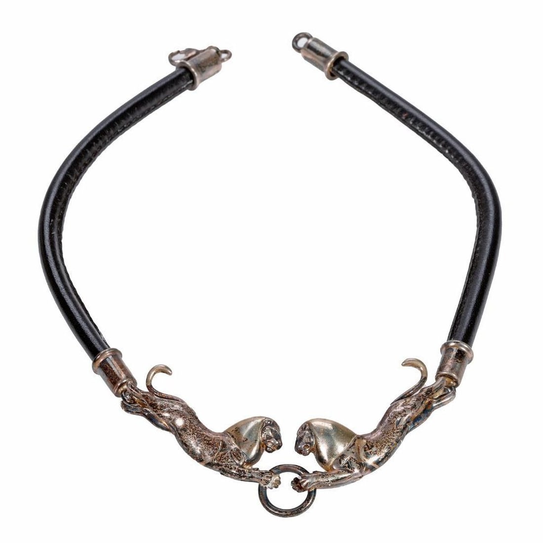 Sergio Bustamonte sterling & leather cord necklace: featuring facing lions; weighing 57.35 grams; length: 16 in. (oxidation to metal)