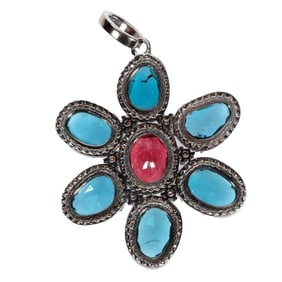 A gem-set and silver pendant