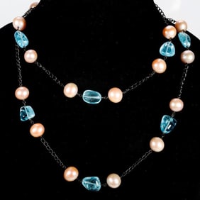 A blue topaz, cultured pearl and silver necklace