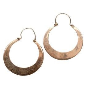A pair of 14k gold hoop earrings