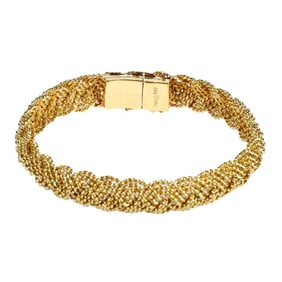 An 18k gold braided wire bangle bracelet