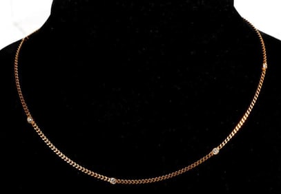 A diamond and 18k gold station necklace