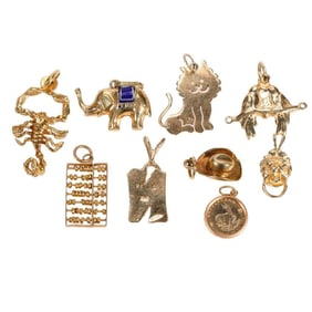A group of gold charms