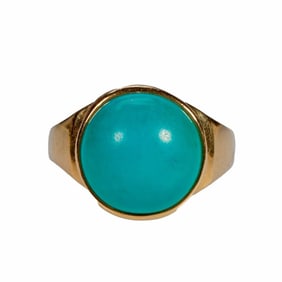 A turquoise and 18k gold ring