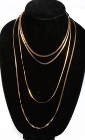 Four 14k gold chains