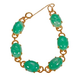 A jade and 10k gold bracelet