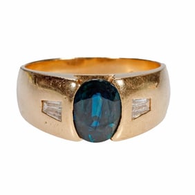 A sapphire, diamond and 14k gold ring