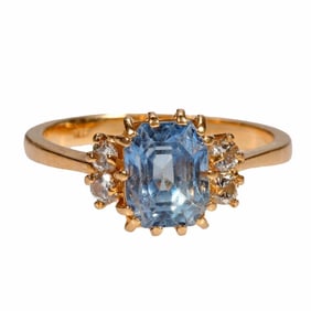 A sapphire, diamond and 14k gold ring