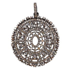 A diamond and silver pendant