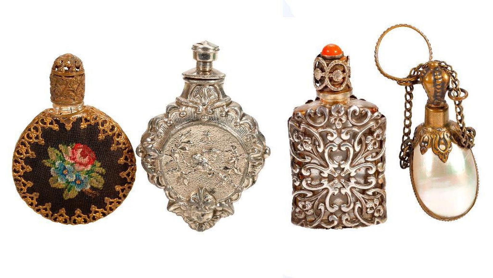 Four Small Vintage Perfume Bottles/Flasks: The vintage group of small perfume bottles/flasks includes one Austrian petit point and metal-mounted bottle; a silver-plated mounted bottle with coral cabochon to lid; a silver-plated putti