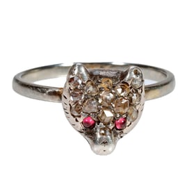 A diamond, ruby, silver and white gold ring