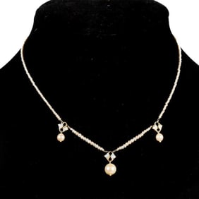 An antique pearl and 14k white gold necklace