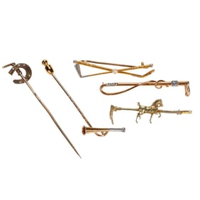 A group of vintage gold pins