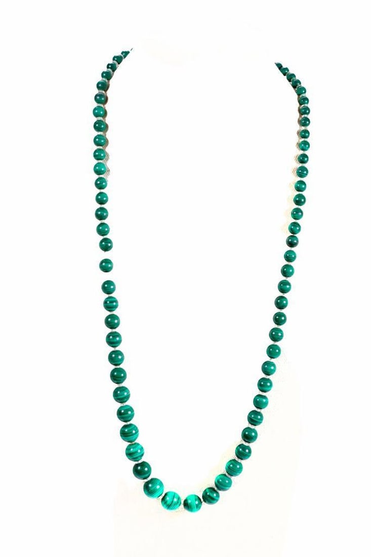 Vintage malachite, rock crystal & 12k gold necklace: designed with graduating malachite beads measuring from approximately 14.00 to 5.20mm, accented by rock crystal rondels; length: 30 in.