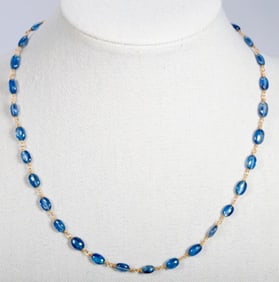 A sapphire and gold-filled necklace