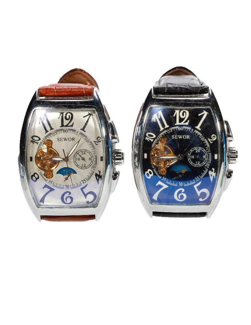 Two Sewor Oversized Watches: Two oversized Sewor Watches, one face silver, one black. NOTE: Watches were running prior to auction, all watches are sold as is regardless of functionality. Please examine the provided photos to