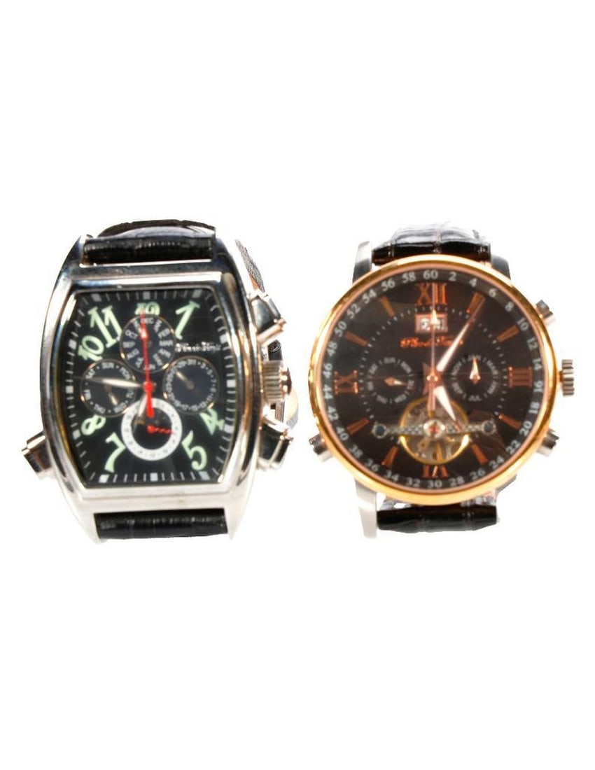 Two Ingersoll Oversized Watches: Two oversized Ingersoll Pere de Temps automatic watches. NOTE: Watches were running prior to auction, all watches are sold as is regardless of functionality. Please examine the provided photos
