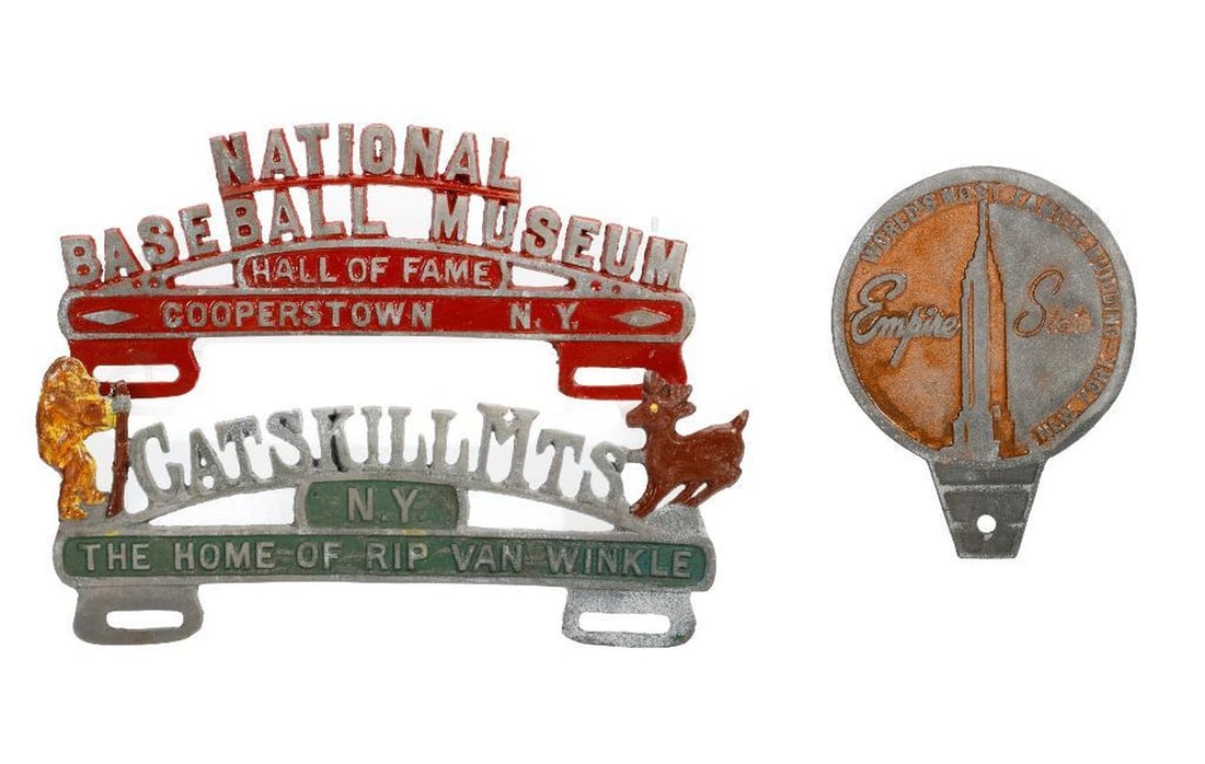 Three License Plate Toppers, New York: A group of vintage cast aluminum license plate toppers: 1.) Catskill Mts, N. Y., The Home of Rip Van Winkle. 2.) Empire State, World's Most Famous Building, New York (fob topper). 3.) National