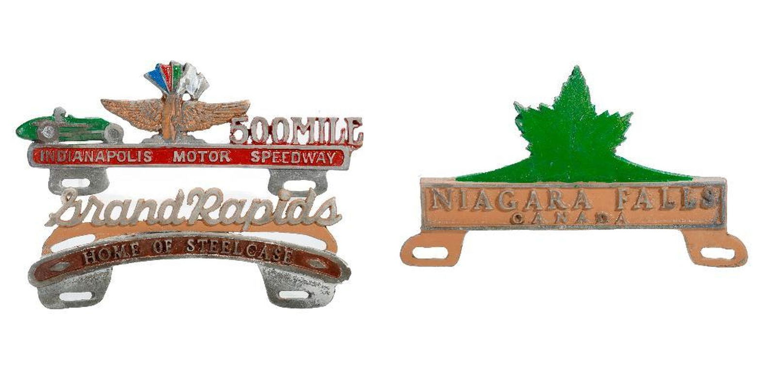 Three License Plate Toppers, Midwest/Canada: A group of vintage cast aluminum license plate toppers: 1.) Grand Rapids, Home of Steelcase. 2.) Indianapolis 500 Mile Motor Speedway. 3.) Niagara Falls, Canada. Greatest length 11 3/4".