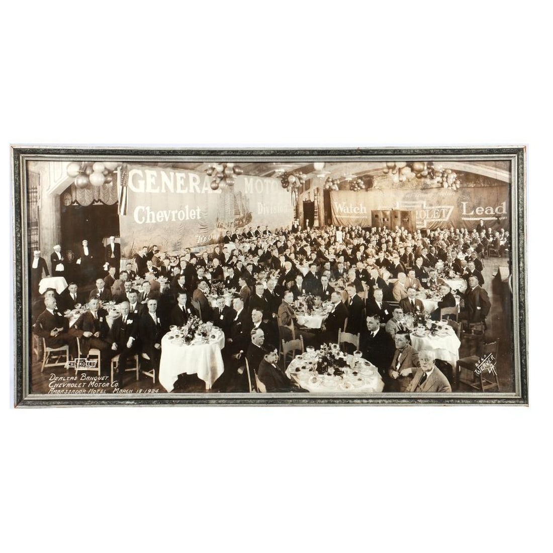 1924 General Motors/Chevrolet Banquet Photo: A General Motors/Chevrolet Dealers Banquet photograph, Ambassador Hotel, March 18, 1924, by Weaver. Showing mostly dour gents at elaborately set tables in the hotel ballroom, waiters standing at the