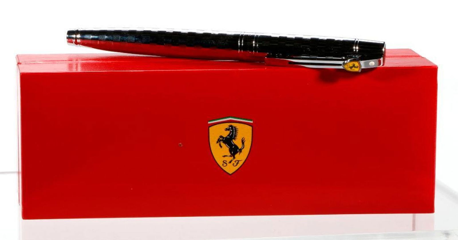 A Ferrari Branded Chrome Sheaffer Fountain Pen: A vintage Sheaffer checkered engraved chrome Scuderia Ferrari branded fountain pen. Includes Ferrari Official Licensed box/packaging. Excellent condition.