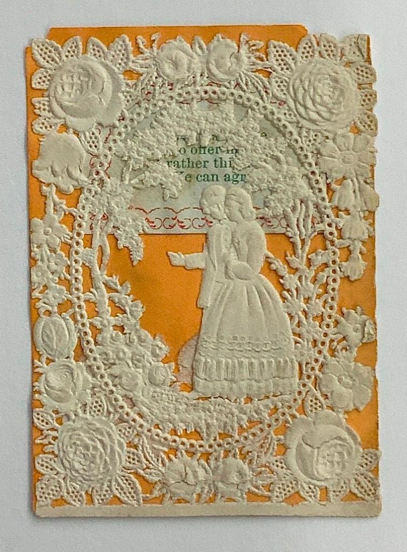 Vintage valentine card: two figures with openwork details: Small Vintage Valentine card with ivory open ornate oval, couple on light orange background. Dimensions: 3 x 2 1/4 inches; Medium: paper, ink; Creation Date: c. 1880; Condition: Yellow, tear on oval,