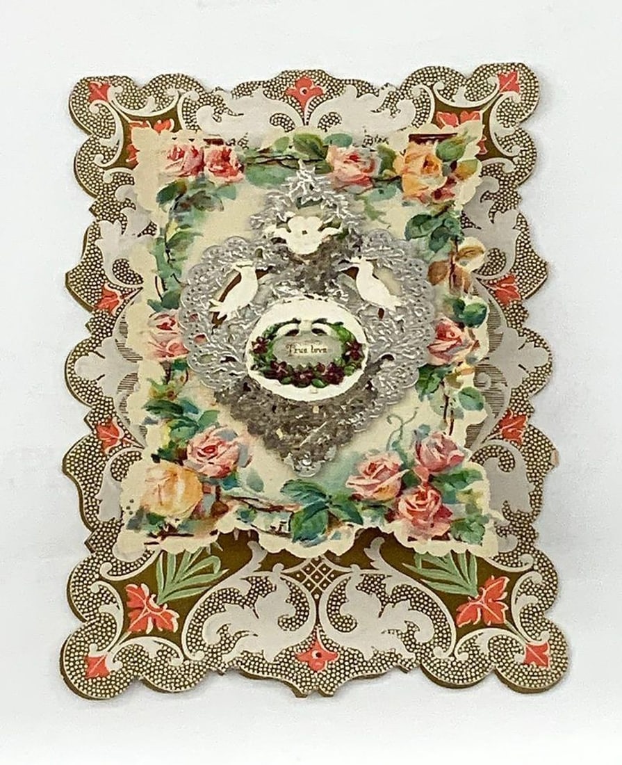 Vintage valentine card: two doves and cherubs: Vintage Valentine card: two doves and cherubs. Valentine with silver heart on center with two doves and two cherubs, printed "True love"; printed greetings inside. Medium: paper, ink. Dimensions: 7 x