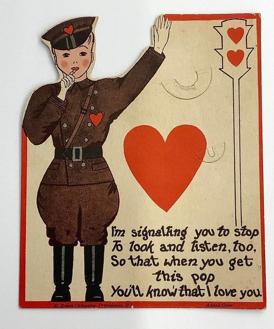 Valentine Card: "I'm signaling you to stop": Valentine with illustration of a policeman holding up his left hand, large red heart on center, traffic light signal with red heart shape lights near right side, text "I'm signaling you to stop / To