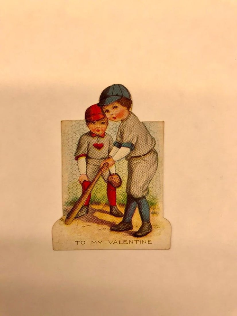 Valentine Card: girl and boy playing baseball: Valentine card with color illustration of girl and boy playing baseball. Medium: paper, ink. Source: The Old Print Shop, Inc. Dimensions: 3 1/4 x 2 1/4 inches. Condition: Good condition overall; minor