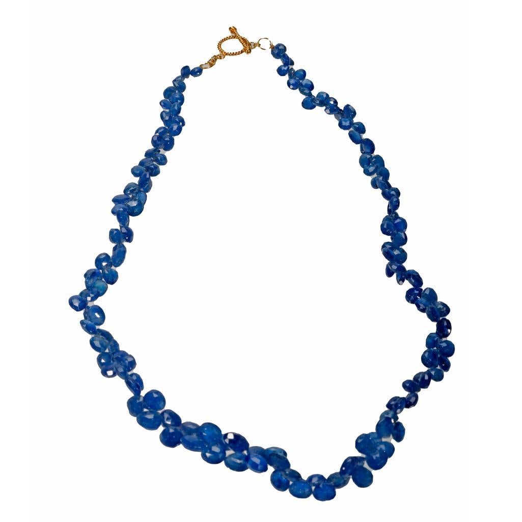 A sapphire briolette and 18k gold necklace: estimated total sapphire weight: 138 carats; weighing approximately 27.65 grams: length: 16 1/2 in.