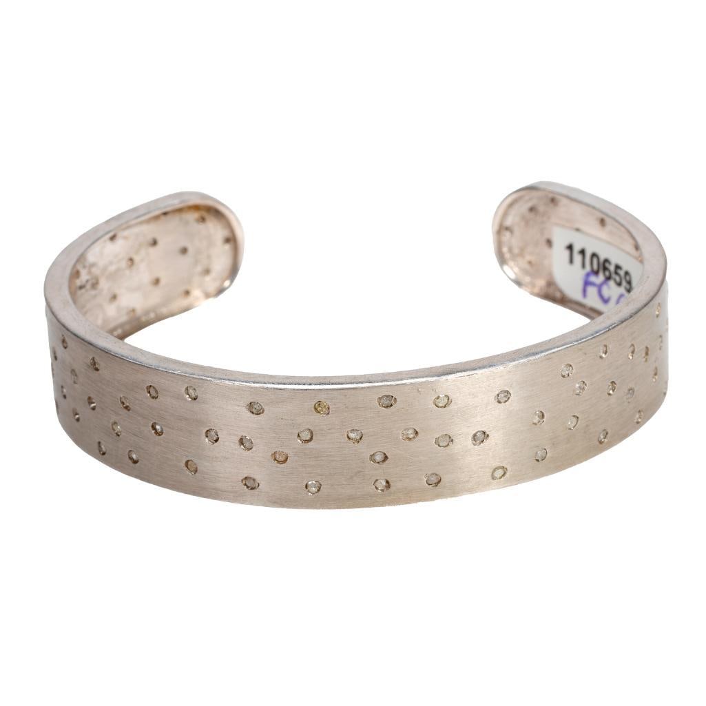 A diamond and sterling silver cuff bangle bracelet (1 of 3)