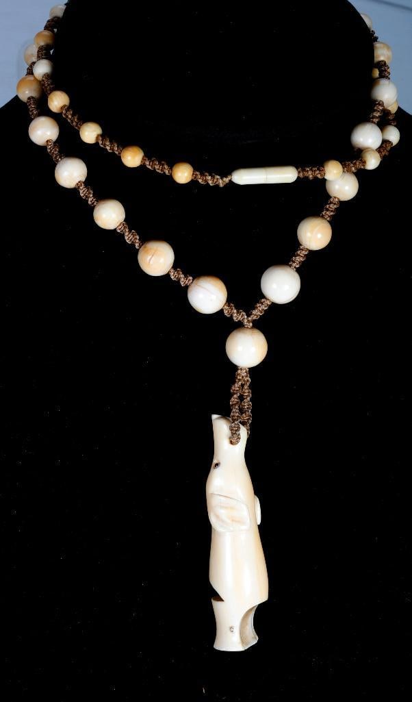 Two carved dog motif whistles (1 of 4)