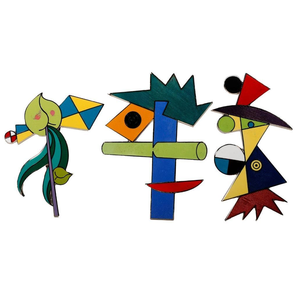 Peter Shire Melrose Emblematic enamel brooches: circa 1985, one Cahuenga #74, one Western #93, and one Lucile #53 designs, each stamped Shire for A&M, with signed pouches; lengths: 2 5/8 - 3in.