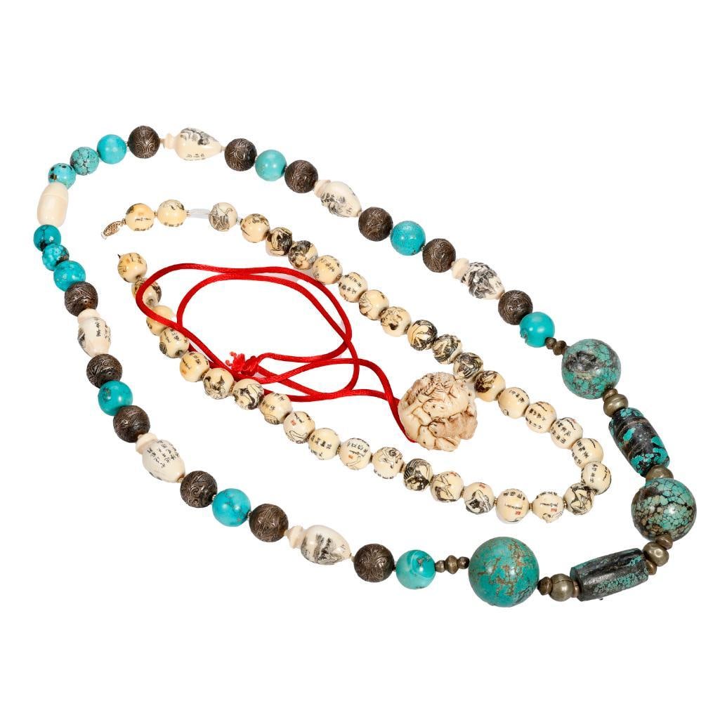 A group of Asian carved and beaded jewelry: including engraved cylindrical worry beads, engraved round beads, an inro, four animal motif fetish beads, and a turquoise and white metal beaded necklace