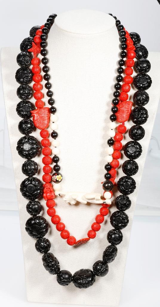 A group of carved jewelry: 40+ pieces including carved bone, antler, tusk, cinnabar, onyx, cloisonne and seeds, with silver and metal (few pieces broken)