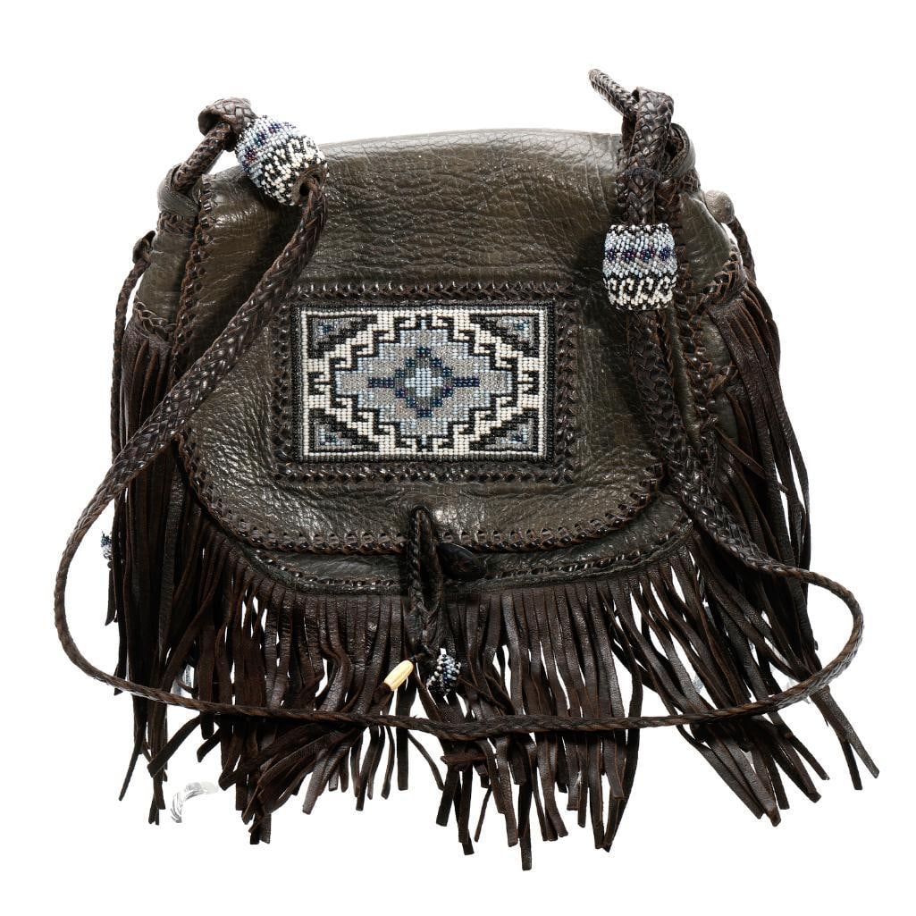 Vintage Handmade Beaded Leather Purse: The small fringed leather western shoulder bag hand-stitched with leather cord, and embellished with a beaded panel on the flap closure, and beaded large "beads" on the braided strap. Approx. 7 1/2" x