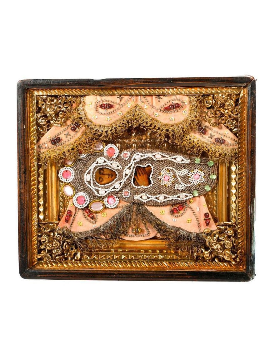 An Icon of the Theotokos with Beaded Shroud, in Kiot.: An icon of the Dormition of the Theotokos, Mother of God, painted on wood, with beaded and faux jeweled shroud, the altar cloths of beaded trimmed pink velvet, with an ornate foil liner in