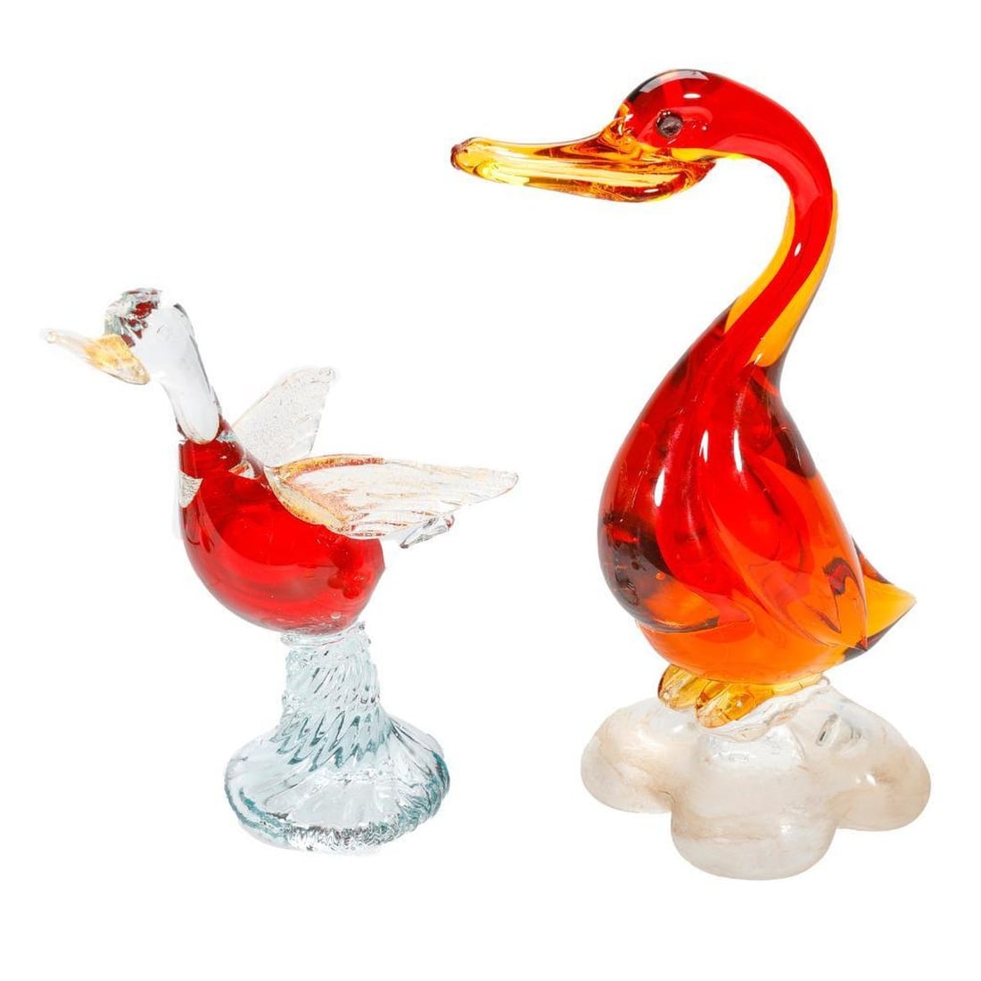 Four Murano Glass Duck or Bird Figures: Comprising two red Murano glass ducks or birds and two Murano glass blue and clear swan or duckling standing approx. 6 3/4" tall (small dings to tip of beak, or possibly just
