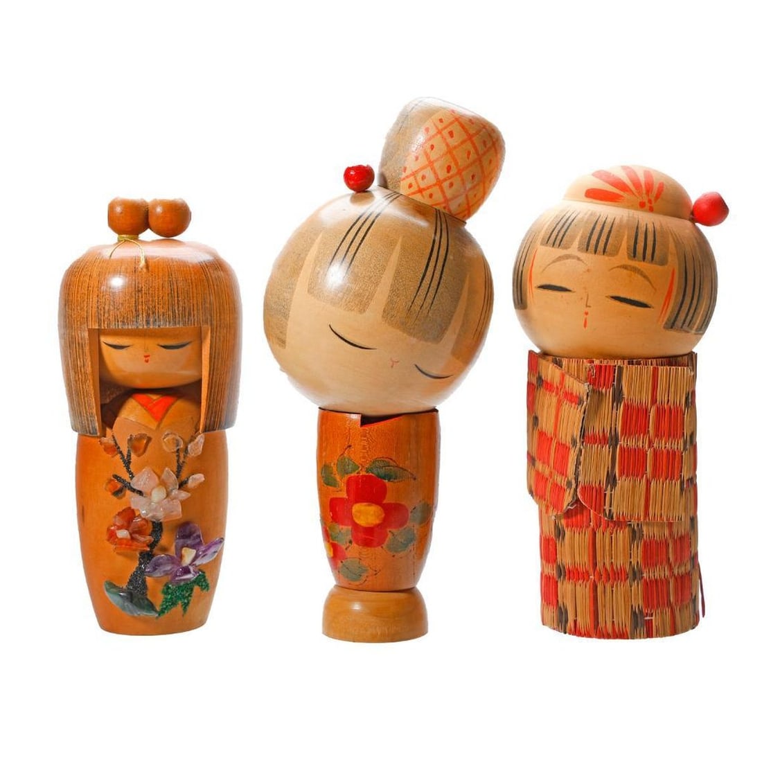 Three Modern Japanese Kokeshi Dolls: The first, a Kojo Tanaka doll with helmet hair and kimono decorated with a "Haru no Yume" (translates as spring dream) stone encrusted fruit tree, with silver label 7"h; the