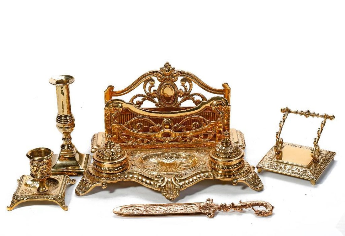 Brass Desk/Table Articles (5), incl. Georgian Candlestick: An English brass candlestick marked "J.T. & Co." (6 1/4"). Together with an assortment of 20th Century French style brass items, including an inkwell/letter tray (6" x 12" x 6 3/4"), a pen rest, a