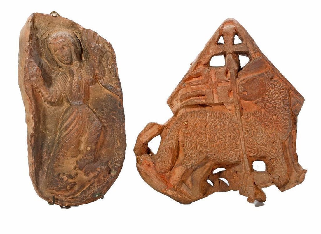Two European Terracotta Reliefs: The two small antique ceramic reliefs, possibly tiles, depict a maiden with long braids and a long girdle belt (8 1/4" x 4 1/4"); and a sheep with flag and cross (8" x 7 1/2").