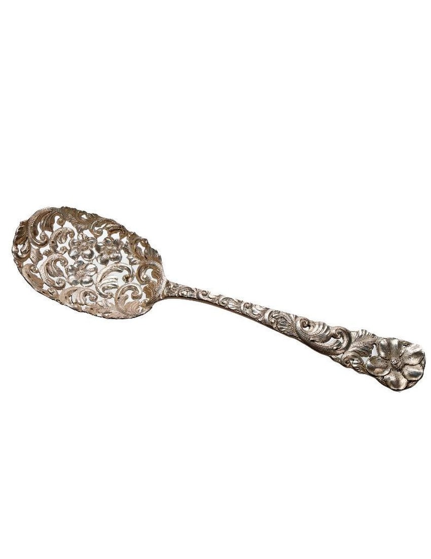 Art Nouveau Sterling Berry Spoon: The reticulated spoon bowl and handle decorated with floral and acanthus leaves. Marked "M R H" [in three diamonds] Sterling." Engraved "R.W.G. Aug. 30 1892." 8 3/4" long. Approx. 76 grams.